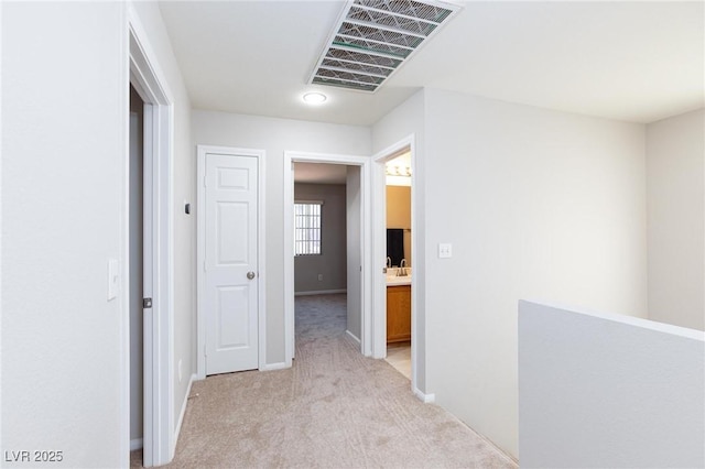 700 Red Bark Ln, Henderson, NV 89011 - corridor with light carpet and baseboards