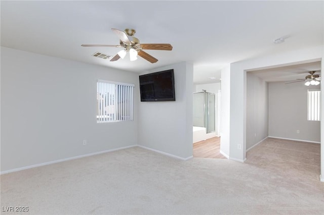 700 Red Bark Ln, Henderson, NV 89011 - empty room featuring a ceiling fan, light colored carpet, and a smoke detector