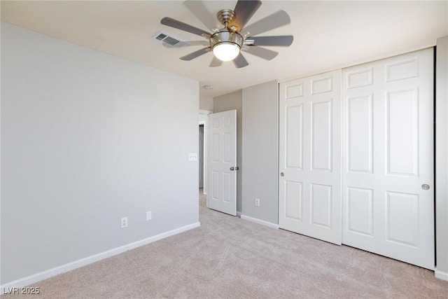 700 Red Bark Ln, Henderson, NV 89011 - unfurnished bedroom featuring light colored carpet, a closet, and ceiling fan