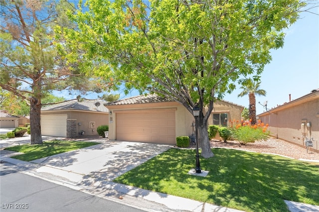 3495 Eagle Bend St, Las Vegas, NV 89122 - view of front of house featuring stucco siding, a garage, a front lawn, driveway, and a tiled roof