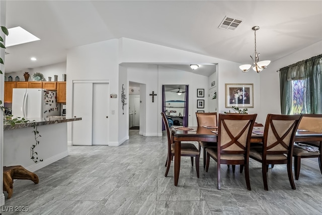 3495 Eagle Bend St, Las Vegas, NV 89122 - dining area with vaulted ceiling and a chandelier