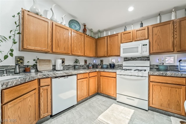 3495 Eagle Bend St, Las Vegas, NV 89122 - kitchen featuring white appliances, recessed lighting, and brown cabinets
