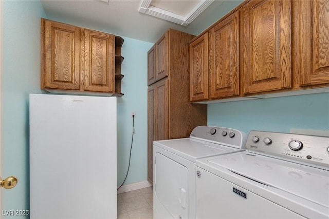 8213 Cabin Springs Ave, Las Vegas, NV 89131 - washroom featuring cabinet space, washing machine and clothes dryer, and light tile patterned flooring