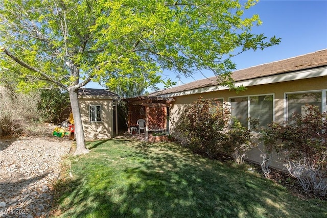 8213 Cabin Springs Ave, Las Vegas, NV 89131 - view of grassy yard with a pergola and a storage unit