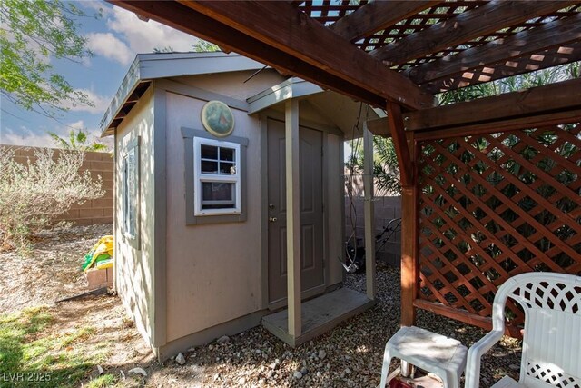 8213 Cabin Springs Ave, Las Vegas, NV 89131 - view of shed with a pergola