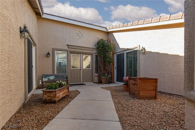 8213 Cabin Springs Ave, Las Vegas, NV 89131 - view of exterior entry featuring stucco siding