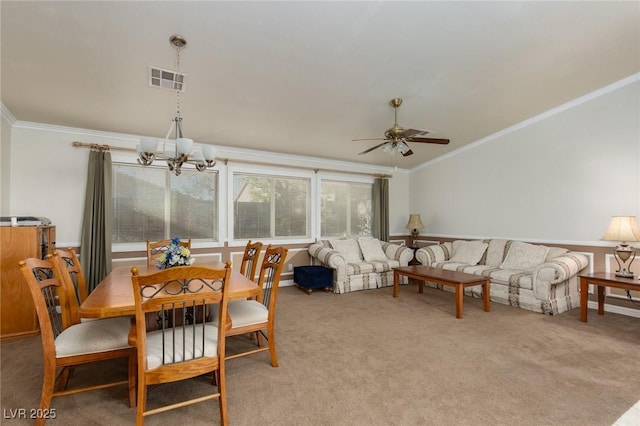 8213 Cabin Springs Ave, Las Vegas, NV 89131 - dining room featuring crown molding, ceiling fan, a chandelier, and carpet flooring