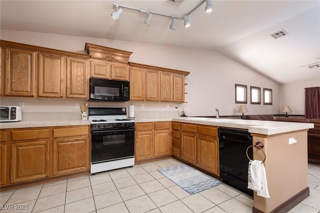 8213 Cabin Springs Ave, Las Vegas, NV 89131 - kitchen featuring black appliances, a peninsula, vaulted ceiling, track lighting, and light tile patterned floors