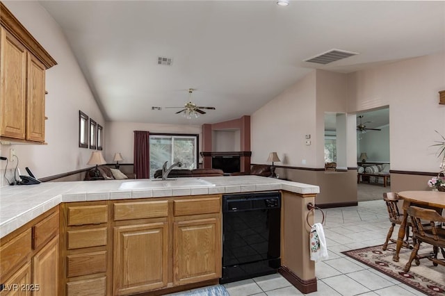 8213 Cabin Springs Ave, Las Vegas, NV 89131 - kitchen featuring black dishwasher, ceiling fan, vaulted ceiling, open floor plan, and a peninsula