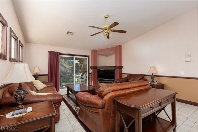8213 Cabin Springs Ave, Las Vegas, NV 89131 - living area with light tile patterned flooring, a ceiling fan, and vaulted ceiling