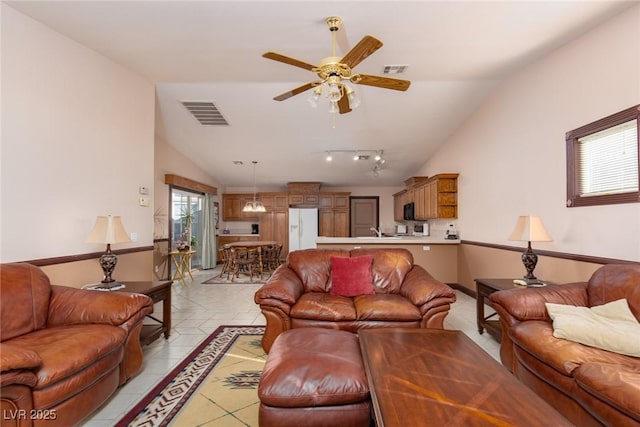 8213 Cabin Springs Ave, Las Vegas, NV 89131 - living room with vaulted ceiling, a ceiling fan, and light tile patterned flooring