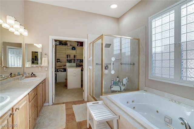 10320 Luxembourg Ave, Las Vegas, NV 89145 - bathroom featuring a stall shower, healthy amount of natural light, a tub with jets, and double vanity