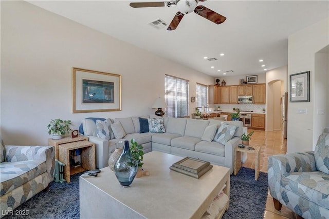 10320 Luxembourg Ave, Las Vegas, NV 89145 - living area with ceiling fan, arched walkways, and recessed lighting