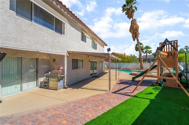 327 Fuente Dr, Henderson, NV 89014 - view of jungle gym featuring a fenced backyard and a patio area