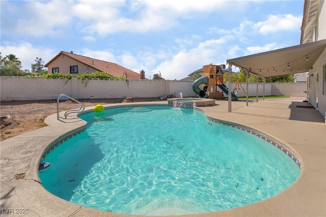 327 Fuente Dr, Henderson, NV 89014 - view of pool featuring a patio, a fenced backyard, a water slide, a playground, and a pool with connected hot tub