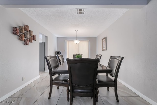 327 Fuente Dr, Henderson, NV 89014 - dining room featuring a textured ceiling