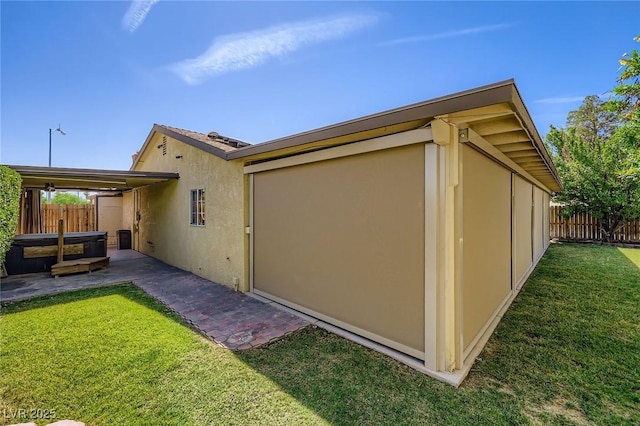 3557 Wayne Cir, Las Vegas, NV 89121 - back of property with stucco siding, a patio, and a hot tub