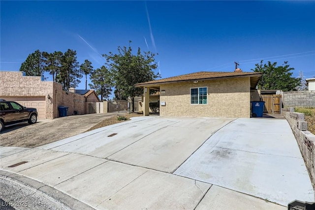 3557 Wayne Cir, Las Vegas, NV 89121 - view of property exterior featuring a gate and stucco siding