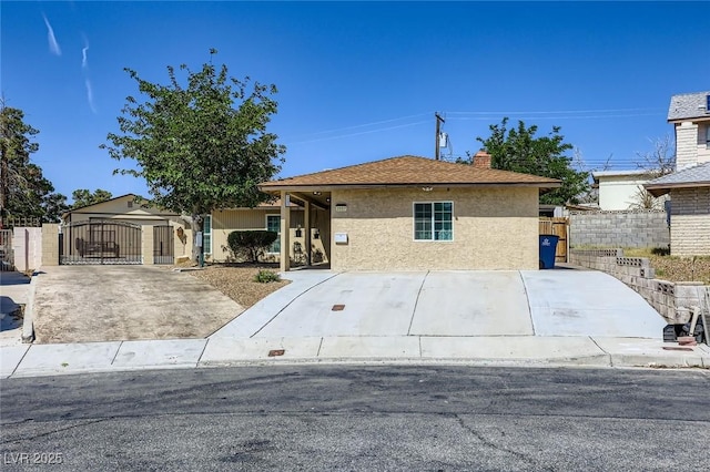 3557 Wayne Cir, Las Vegas, NV 89121 - view of front of property featuring a gate, stucco siding, and a chimney