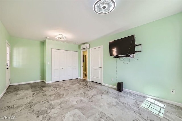3557 Wayne Cir, Las Vegas, NV 89121 - unfurnished bedroom featuring a wall mounted air conditioner and a closet