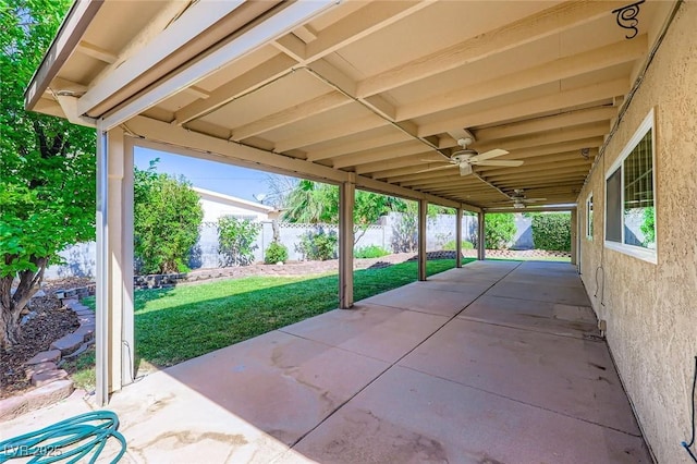 3557 Wayne Cir, Las Vegas, NV 89121 - fenced backyard featuring a ceiling fan and a patio