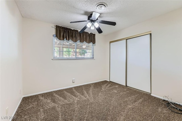 3557 Wayne Cir, Las Vegas, NV 89121 - unfurnished bedroom with carpet flooring, a textured ceiling, a closet, and a ceiling fan