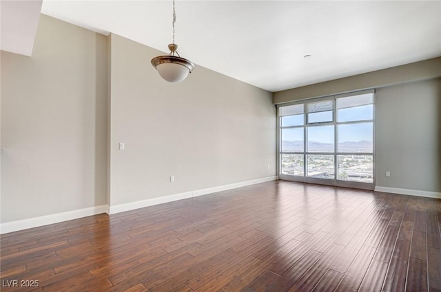 150 Las Vegas Blvd Unit 1716, Las Vegas, NV 89101 - empty room featuring dark wood-style flooring and a mountain view