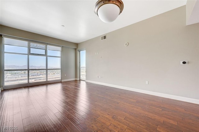 150 Las Vegas Blvd Unit 1716, Las Vegas, NV 89101 - unfurnished room featuring dark wood-style flooring and baseboards