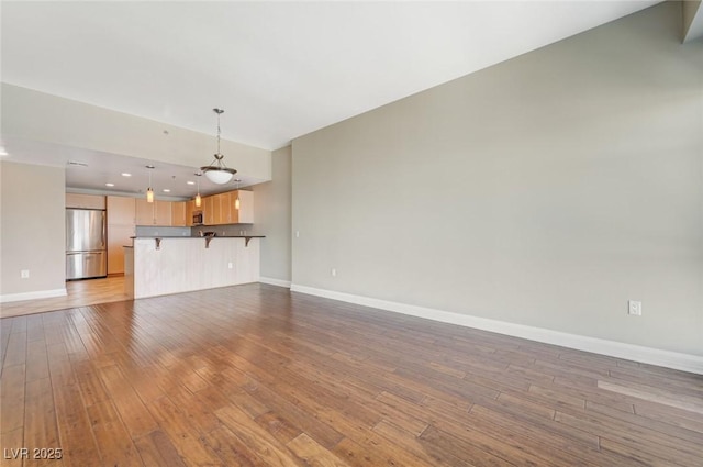 150 Las Vegas Blvd Unit 1716, Las Vegas, NV 89101 - unfurnished living room featuring hardwood / wood-style flooring and recessed lighting
