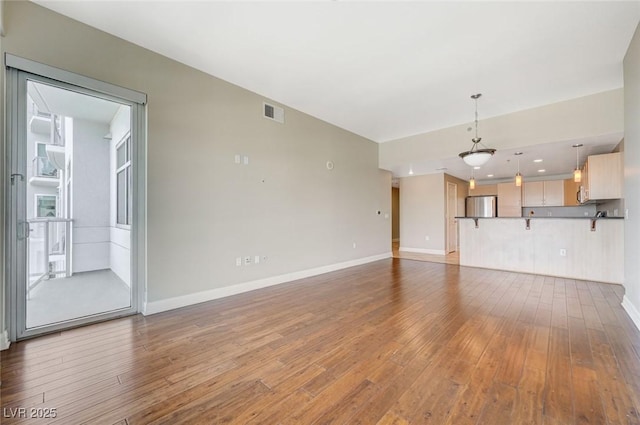 150 Las Vegas Blvd Unit 1716, Las Vegas, NV 89101 - unfurnished living room featuring hardwood / wood-style flooring