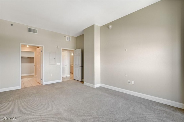 150 Las Vegas Blvd Unit 1716, Las Vegas, NV 89101 - unfurnished bedroom featuring light carpet, a spacious closet, and electric panel