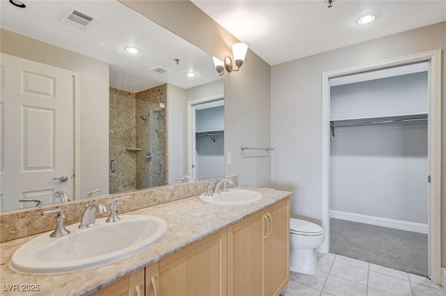150 Las Vegas Blvd Unit 1716, Las Vegas, NV 89101 - full bathroom featuring a stall shower, double vanity, a spacious closet, tile patterned floors, and recessed lighting