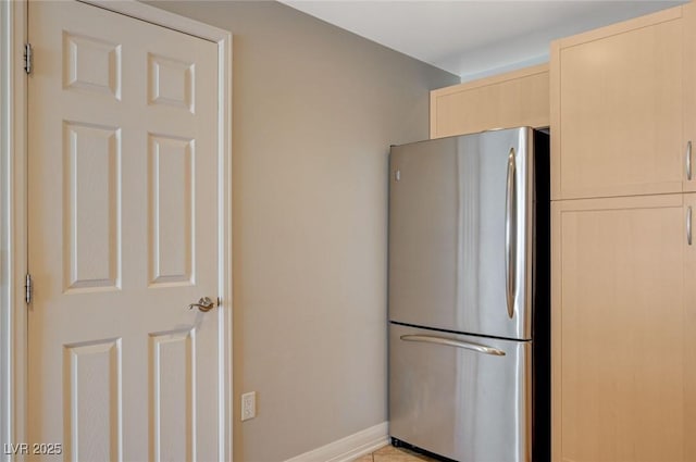 150 Las Vegas Blvd Unit 1716, Las Vegas, NV 89101 - kitchen with freestanding refrigerator and light brown cabinets