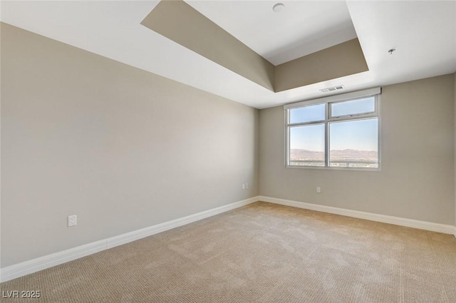 150 Las Vegas Blvd Unit 1716, Las Vegas, NV 89101 - empty room featuring light carpet, a tray ceiling, and a pendent fire sprinkler