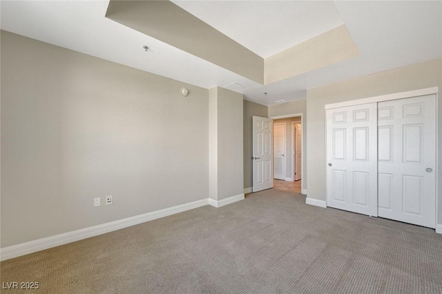 150 Las Vegas Blvd Unit 1716, Las Vegas, NV 89101 - unfurnished bedroom with carpet flooring, a closet, and a raised ceiling