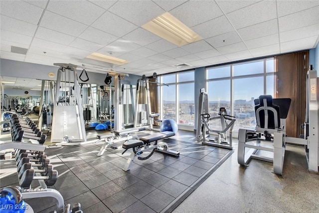 150 Las Vegas Blvd Unit 1716, Las Vegas, NV 89101 - exercise room with a paneled ceiling, a wall of windows, and a view of city