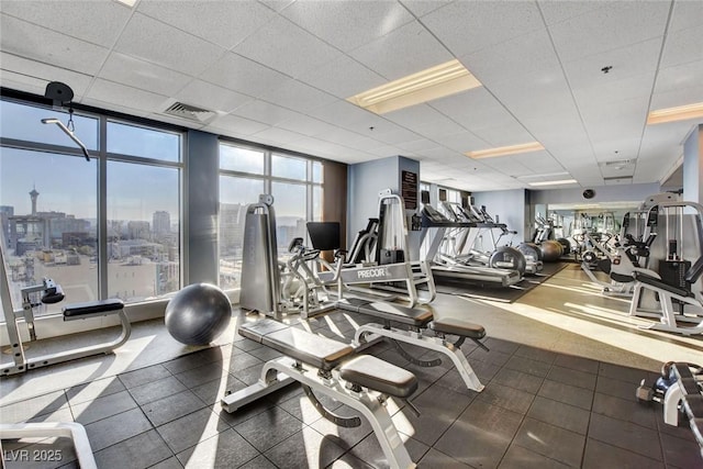 150 Las Vegas Blvd Unit 1716, Las Vegas, NV 89101 - workout area featuring a drop ceiling, a city view, and expansive windows