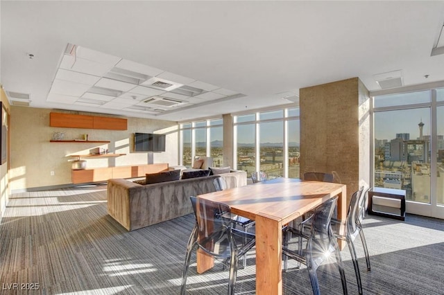 150 Las Vegas Blvd Unit 1716, Las Vegas, NV 89101 - dining space with carpet, expansive windows, and a drop ceiling