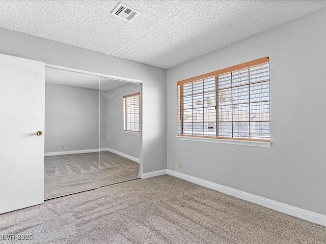 5861 Medallion Dr Unit 202, Las Vegas, NV 89122 - carpeted spare room with a textured ceiling