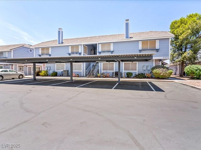 5861 Medallion Dr Unit 202, Las Vegas, NV 89122 - view of building exterior featuring covered parking and stairs