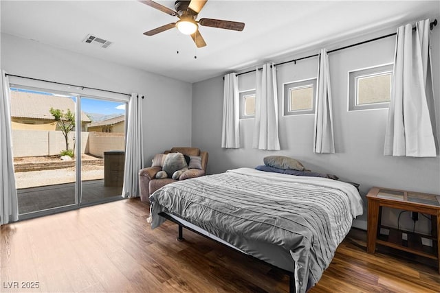 4212 Helens Pouroff Ave, North Las Vegas, NV 89085 - bedroom featuring access to exterior, multiple windows, wood finished floors, and ceiling fan