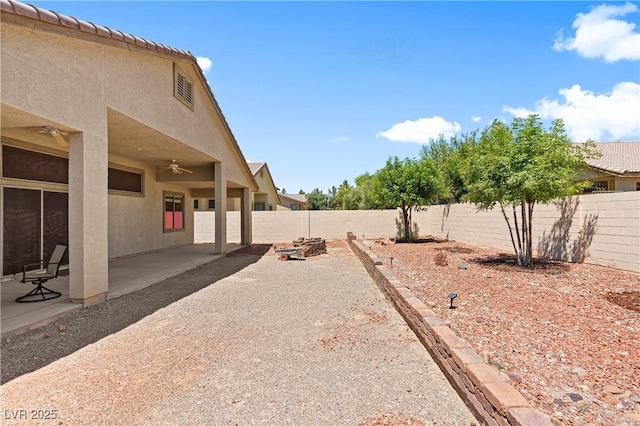 4212 Helens Pouroff Ave, North Las Vegas, NV 89085 - fenced backyard with ceiling fan and a patio area
