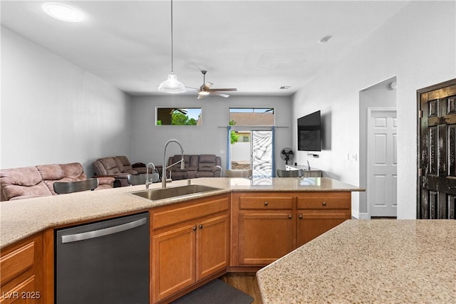 4212 Helens Pouroff Ave, North Las Vegas, NV 89085 - kitchen featuring dishwasher, open floor plan, ceiling fan, wood finished floors, and brown cabinetry