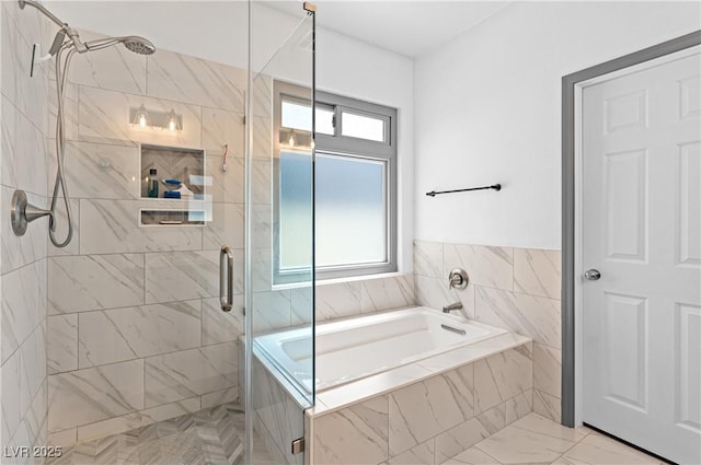 4212 Helens Pouroff Ave, North Las Vegas, NV 89085 - bathroom with a shower stall, a bath, and marble look tile flooring