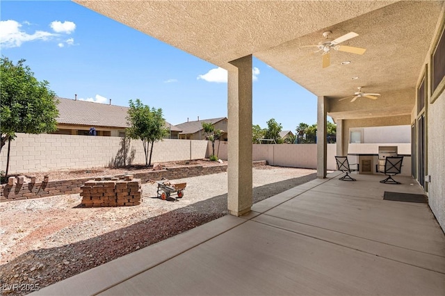 4212 Helens Pouroff Ave, North Las Vegas, NV 89085 - fenced backyard with ceiling fan and a patio area