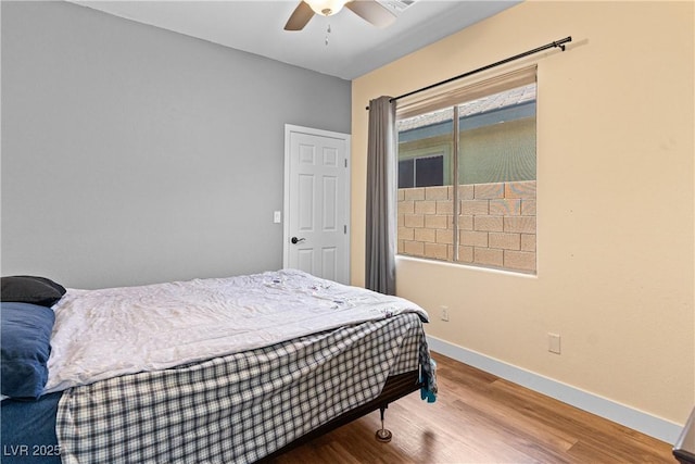 4212 Helens Pouroff Ave, North Las Vegas, NV 89085 - bedroom with wood finished floors and a ceiling fan