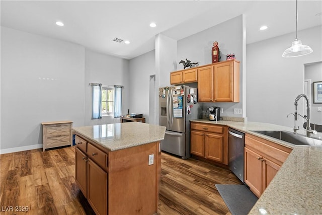 4212 Helens Pouroff Ave, North Las Vegas, NV 89085 - kitchen featuring stainless steel appliances, dark wood-style flooring, a center island, light stone countertops, and pendant lighting
