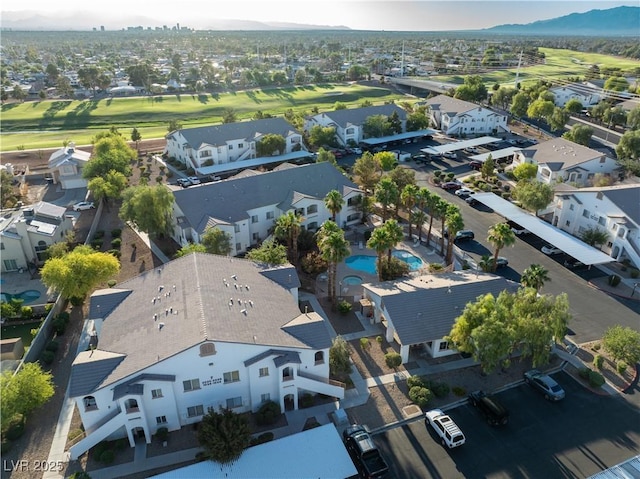 5655 E Sahara Ave Unit 1053, Las Vegas, NV 89142 - aerial perspective of suburban area featuring a local golf course and a mountain backdrop