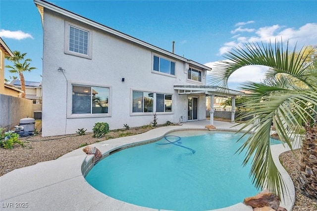 600 Baysville Ct, Las Vegas, NV 89144 - rear view of house with a pergola, stucco siding, an outdoor pool, and a patio area