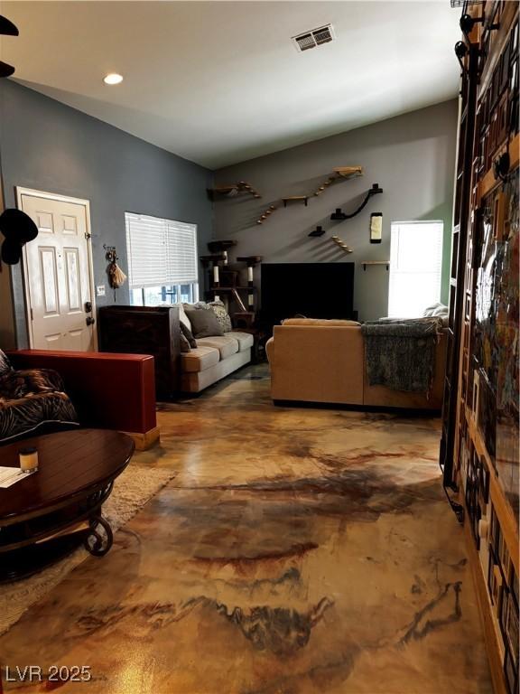3601 Slapton Ave, North Las Vegas, NV 89031 - living room with concrete flooring and recessed lighting